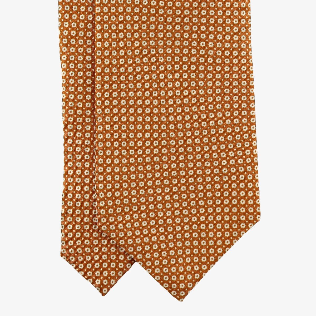 Serà Fine Silk oranžinis šilkinis kaklaraištis su baltų gėlių raštu