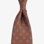 Shibumi Firenze oranžinis šilkinis kaklaraištis su mėlynų gėlių raštu