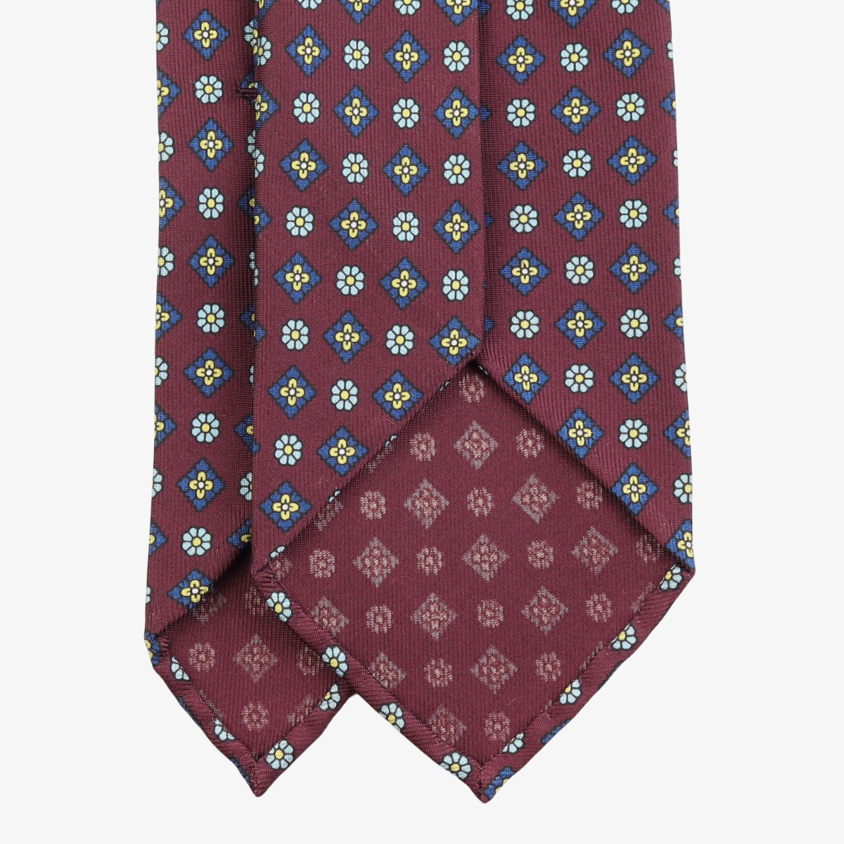 Shibumi Firenze tamsiai raudonas šilkinis kaklaraištis su mėlynų gėlių raštu