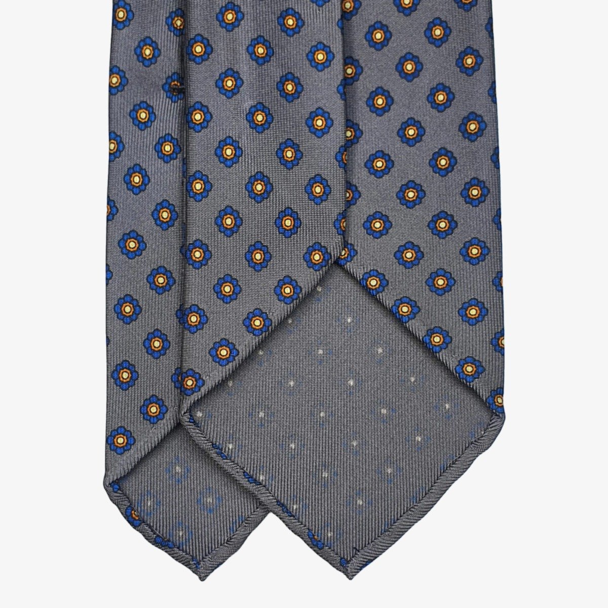 Shibumi Firenze pilkas šilkinis kaklaraištis su mėlynų gėlių raštu