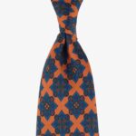 Shibumi Firenze orange Ancient Madder silk tie with blue medallion pattern