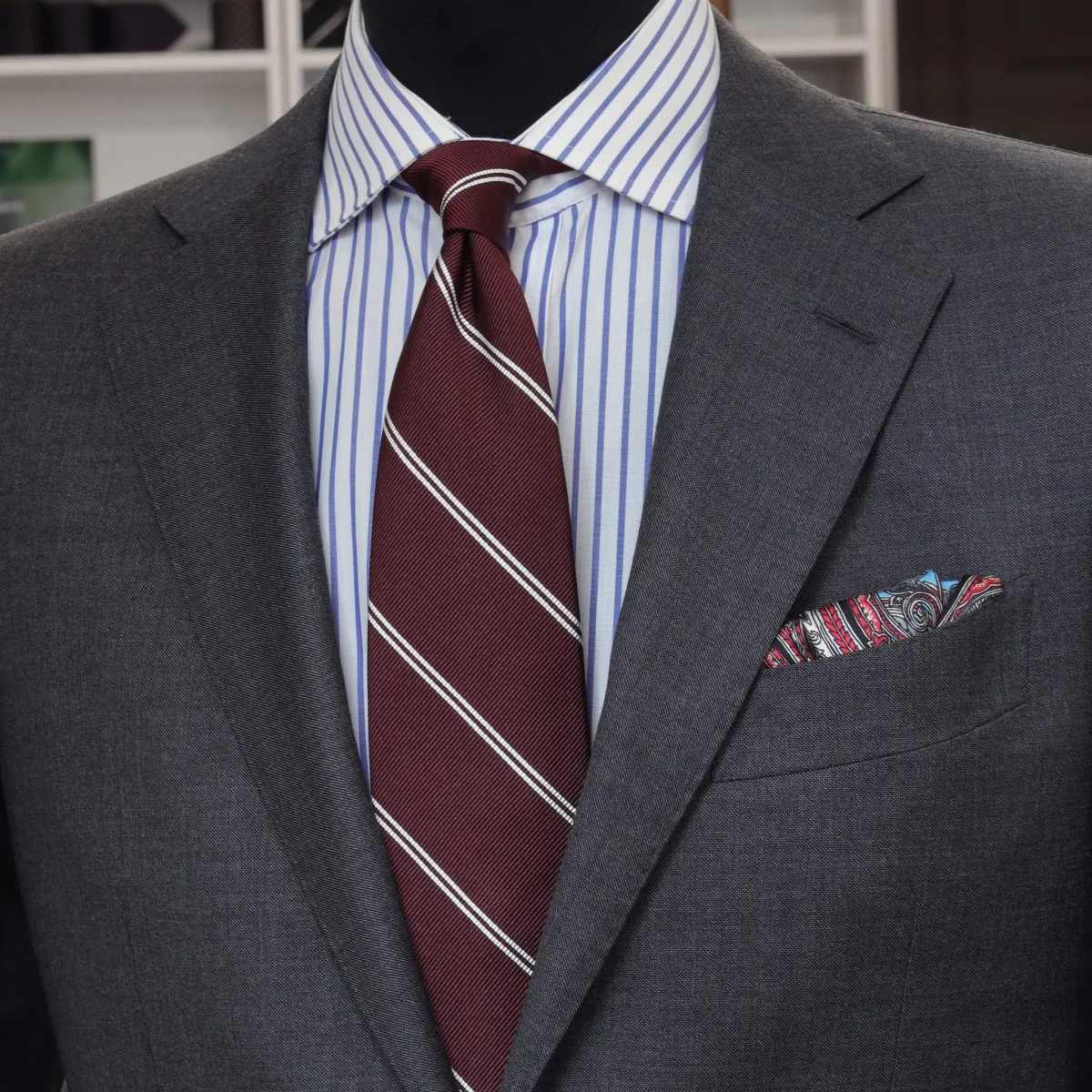 Charcoal grey suit blue striped shirt burgundy striped tie combination