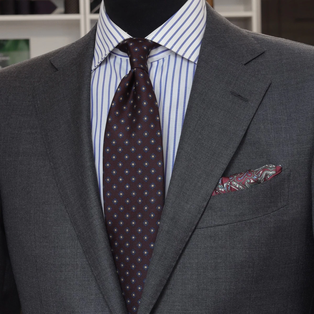 Charcoal grey suit blue striped shirt eggplant patterned tie combination