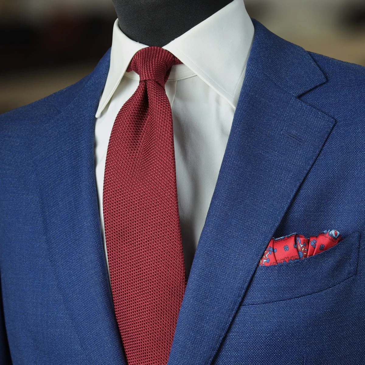 Blue suit, white shirt and red grenadine tie combination
