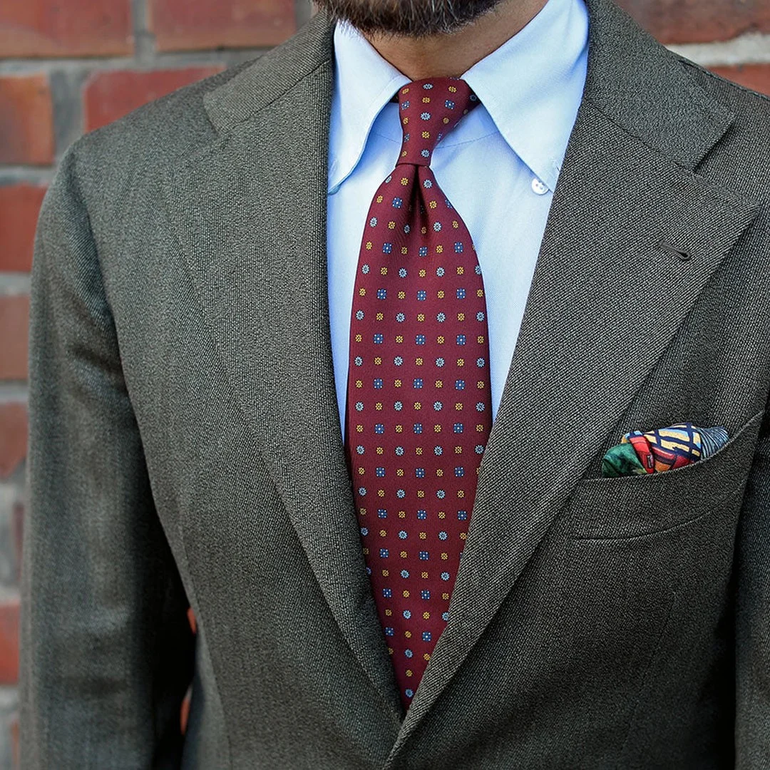 Red tie and grey suit combination