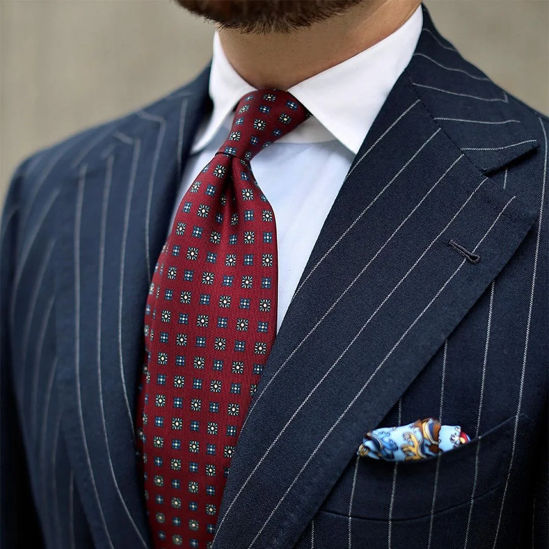 Red tie and navy suit combination